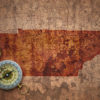Map of tennessee state on a old vintage crack paper background with compass