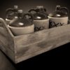 Basket of old moonshine jugs during prohibition era..