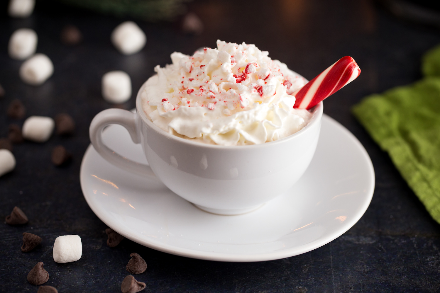 Peppermint hot chocolate in a white mug on the table