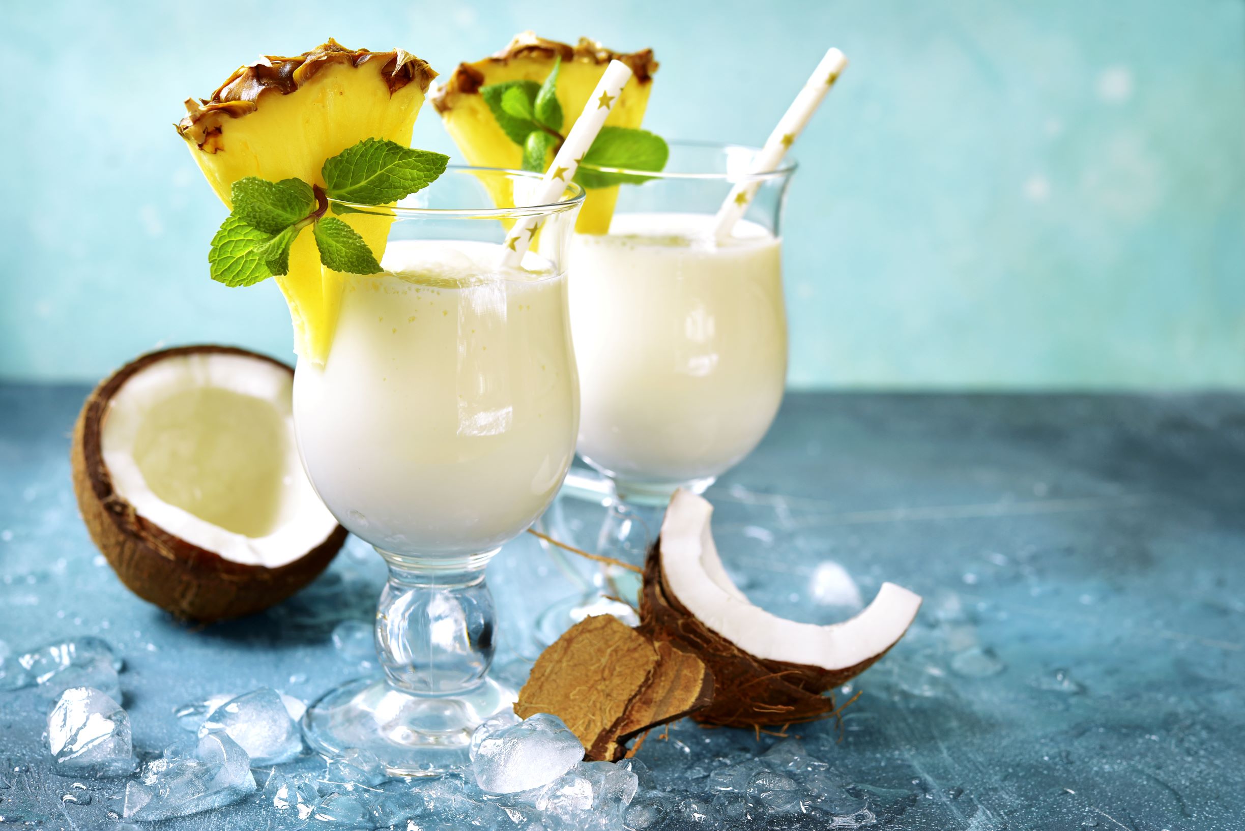 Pina coloda cocktails with ice, coconut and pineaple