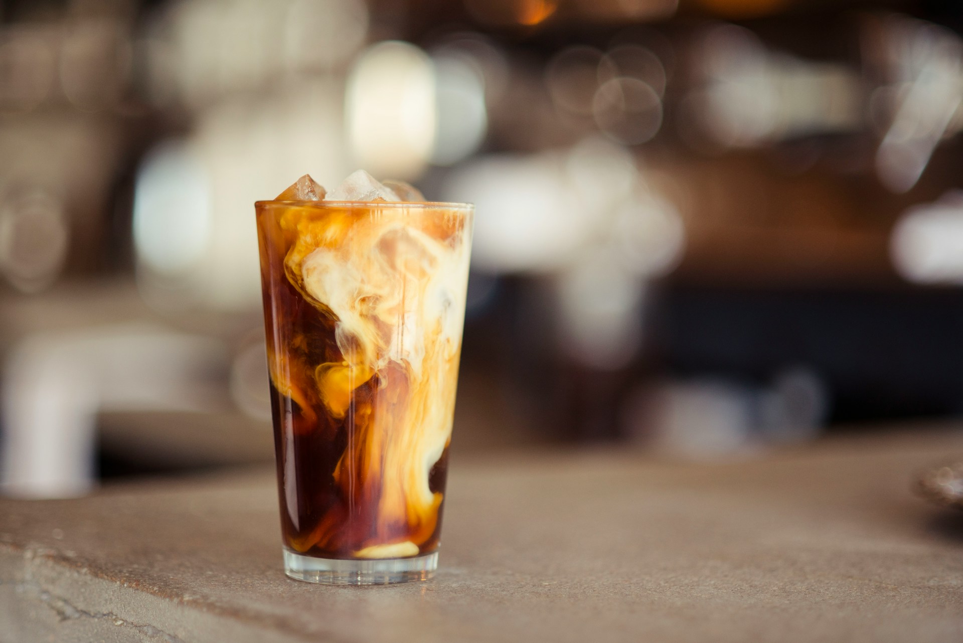 A coffee and cream iced cocktail on a bar counter